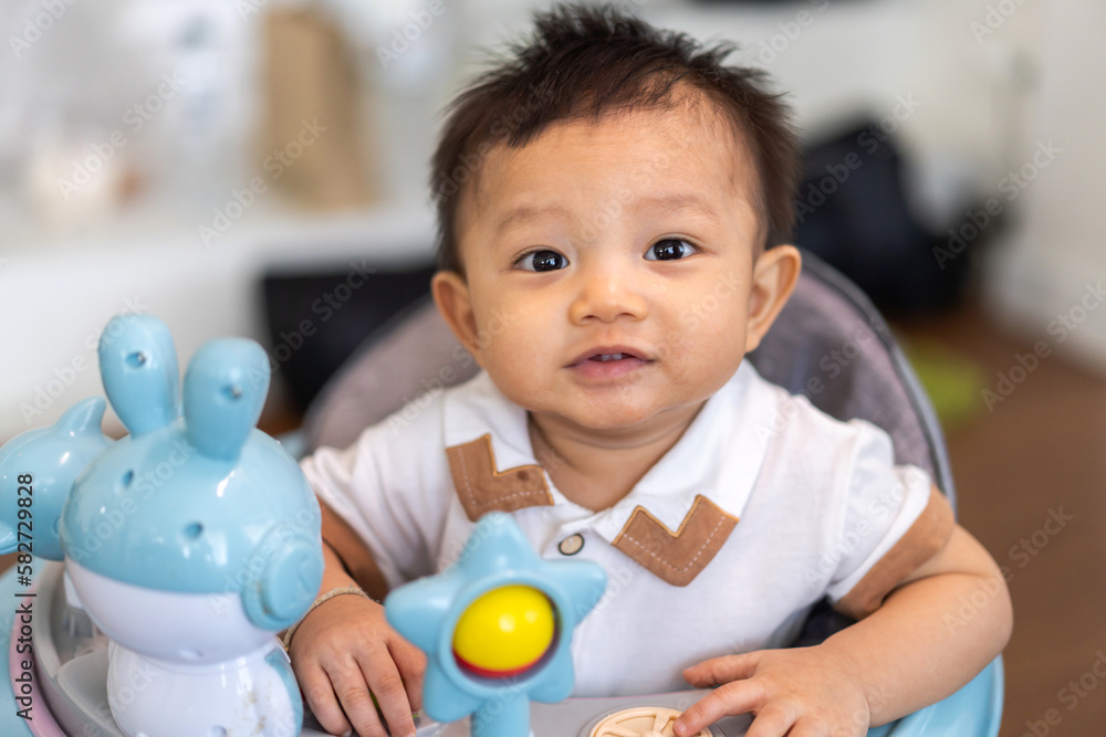 Portrait of happy smile asian baby boy relaxing looking at camera.Cute asian newborn child on the bed at home Portrait of happy smile asian baby boy relaxing looking at camera.Cute asian newborn child on the bed at home