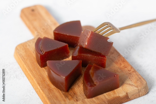 Typical Brazilian specialty: guava paste slices on white plate. photo