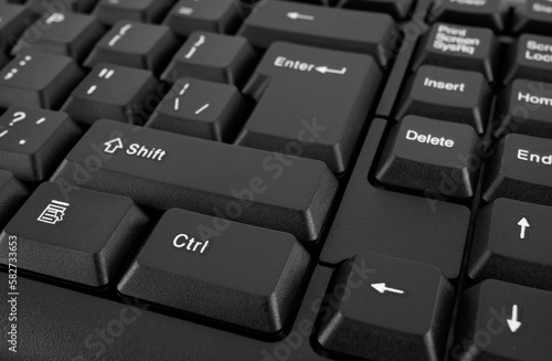 Part of a computer keyboard, black close-up