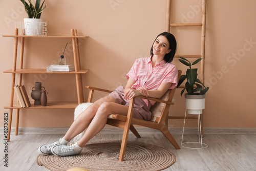 Beautiful woman sitting in ...