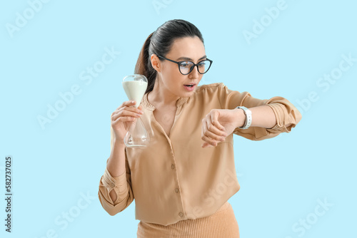 Young woman with hourglass ...