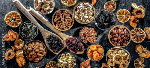 Fototapeta Naklejka Na Ścianę i Meble -  Composition with a variety of dried fruits and assorted nuts.