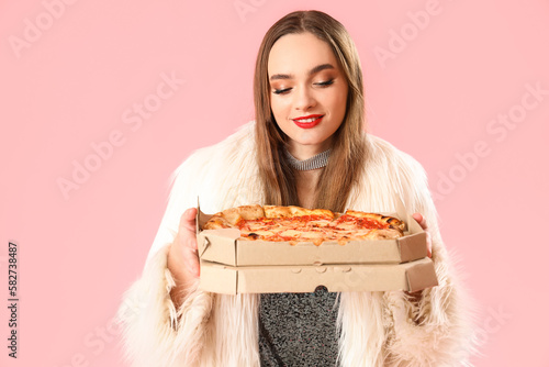 Young woman in fur coat wit...