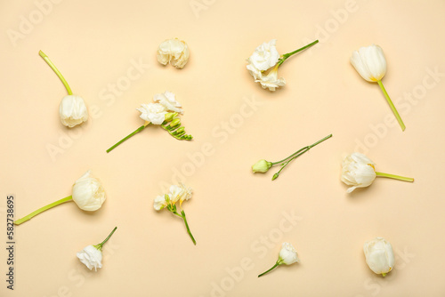 Composition with beautiful spring flowers on color background. Mother's Day celebration