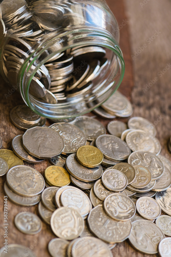 glass jar filled with Australian money glass jar filled with Australian money