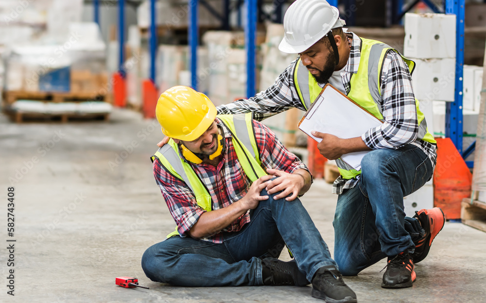 Professional male worker help his colleague after getting accident