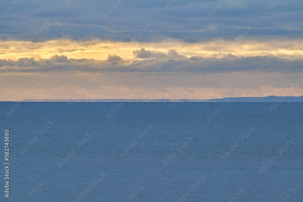 Minimalistic view of a soft sunset in the horizon over the sea