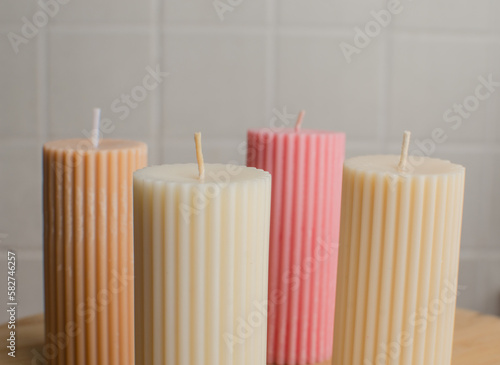 A cylindrical candle made of soy wax