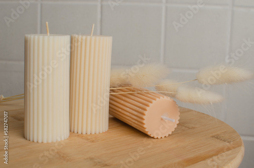A cylindrical candle made of soy wax