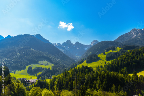 Mountains with meadows, forest and blue sky in Flendruz, Rougemont, Pays-d'Enhaut, Vaud, Switzerland