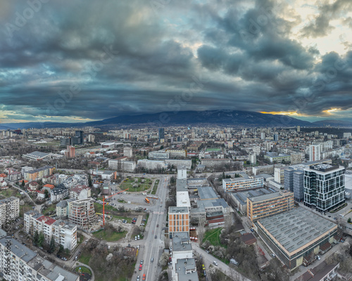 High resolution panorama from a drone  of eastern part of Sofia  Bulgaria  city  with the Vitosha mountain on the backround  during dramatic wheather