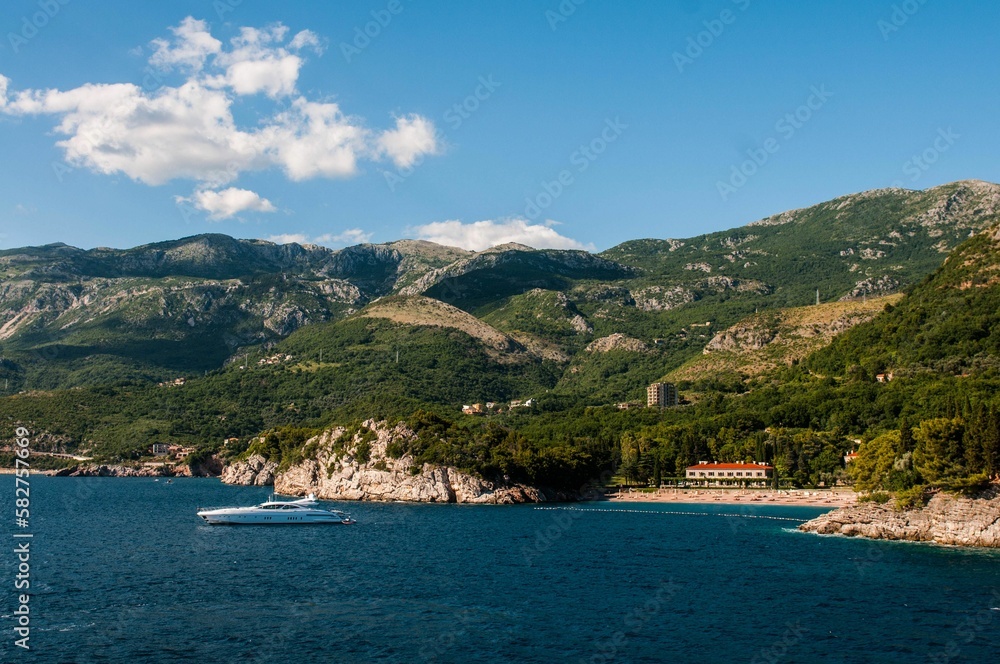 Landscape of a sea and mountain in the background on a sunny day