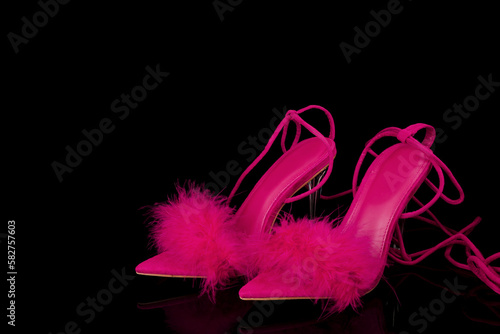 sexy, pink strappy high heel shoes  on a black background © Golden Shark