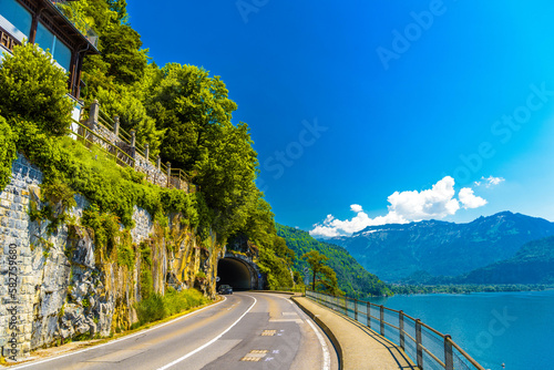 Lake Thun, road and tunnel near mountains, Thunersee Bern Switzerland