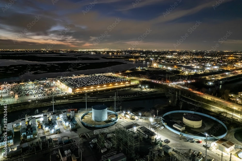 Drone shot of an industrial power plant at night on Island Park in New York