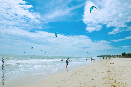 Kitesurfers at Mui Ne beach, Vietnam (Mũi Né beach is one of the best kitesurfing locations in Asia).