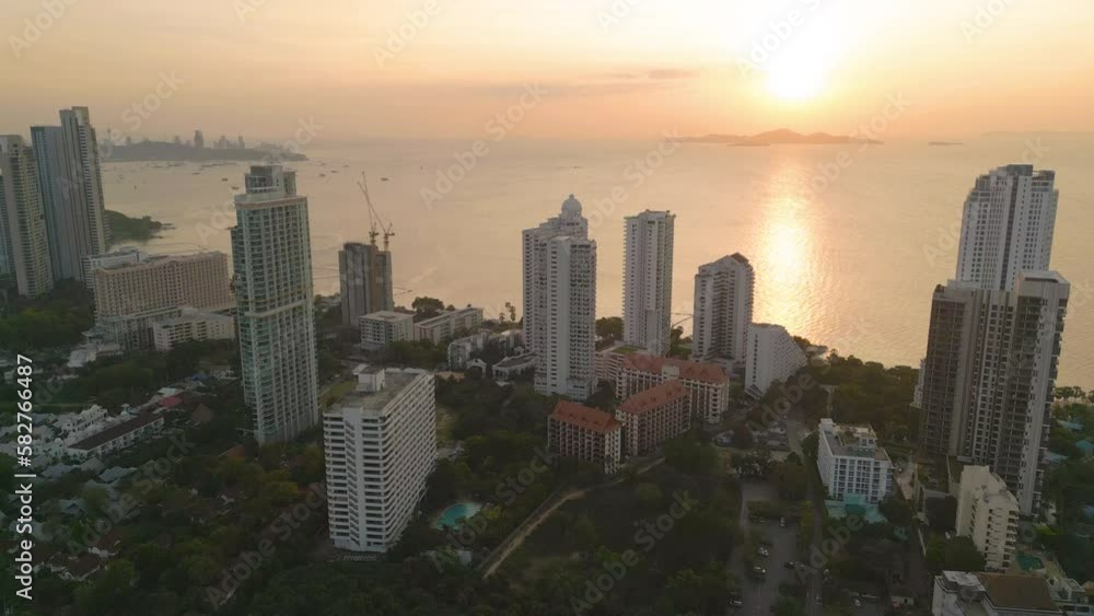 Aerial view of Pattaya sea, beach in Thailand in summer season, urban city with blue sky for travel background. Chon buri skyline. Aerial view of Pattaya sea, beach in Thailand in summer season, urban city with blue sky for travel background. Chon buri skyline.