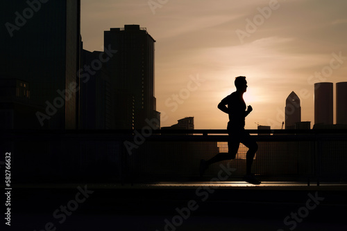 silhouette of a person running in the city at dawn, generative ai