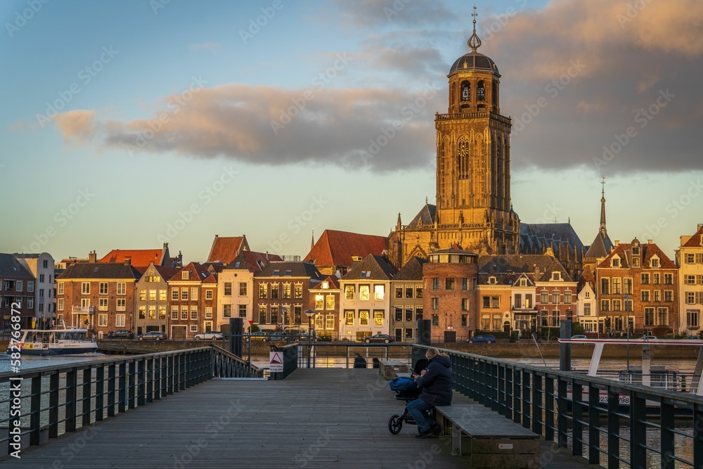 Ferry dock against the Deventer skyline with the Saint Lebuinus Church in the Netherlands