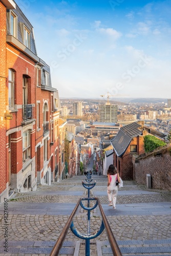 Fotografija Scenic view of a female walking down the Montagne de Bueren stairway in Liege, B
