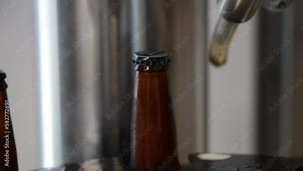 Distillery machine bottling beer in a storage Distillery machine bottling beer in a storage