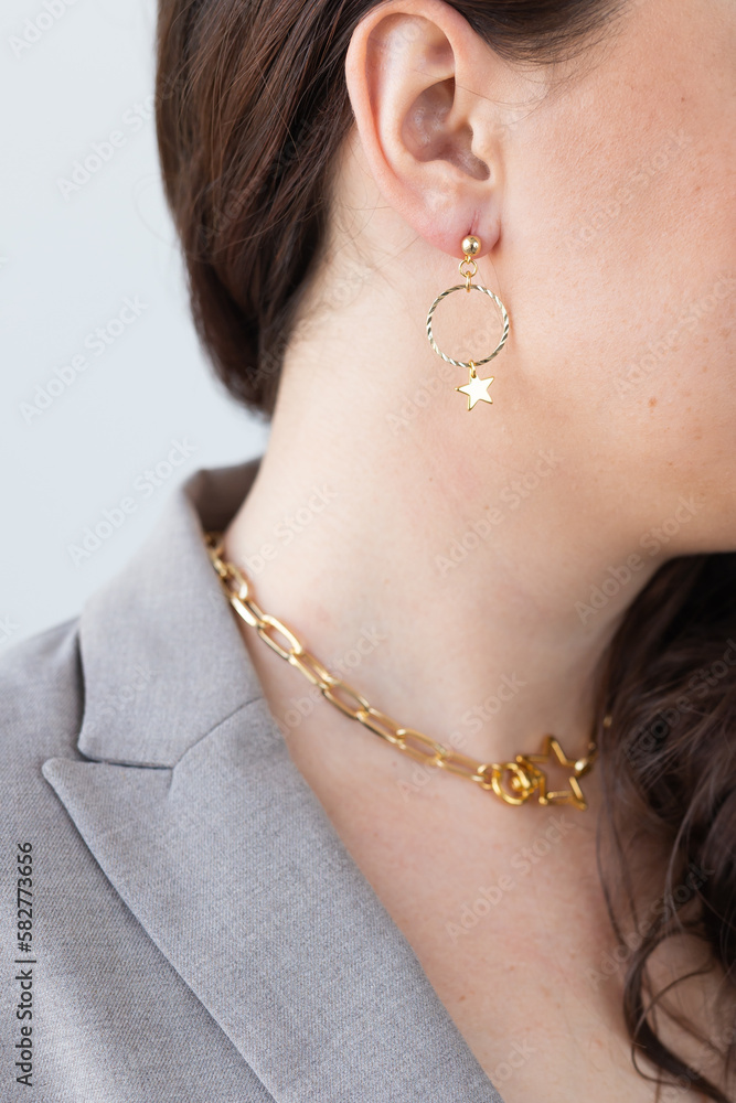 Fashionable and stylish woman in trendy jewelry big earrings . Fashion look beauty and style. Natural makeup and easy styling Fashionable and stylish woman in trendy jewelry big earrings . Fashion look beauty and style. Natural makeup and easy styling