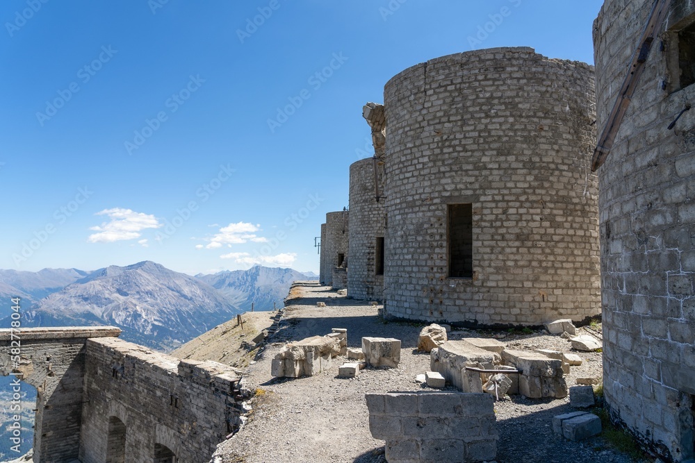 View of ruins of artillery batteries against a background of mountains in Mont Chaberton peak