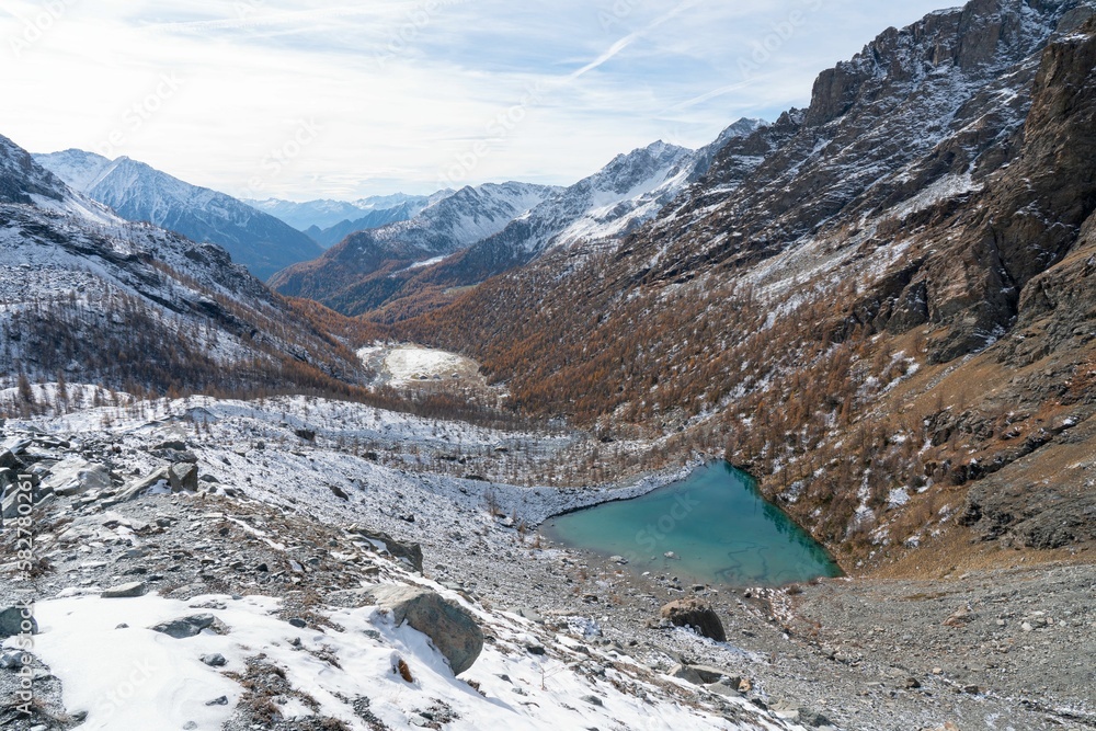 Distant shot of the Lago Blue lake in Ayas Valley, Monte Rosa mountain, Italy
