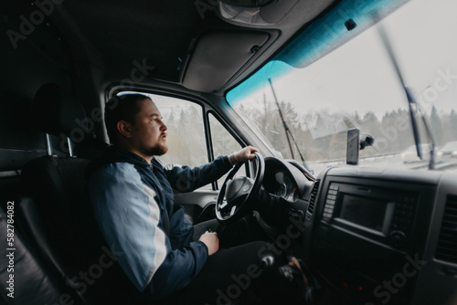 truck driver driving in rainy weather