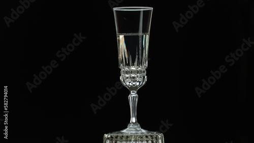 On a holiday, champagne is poured into a crystal glass.