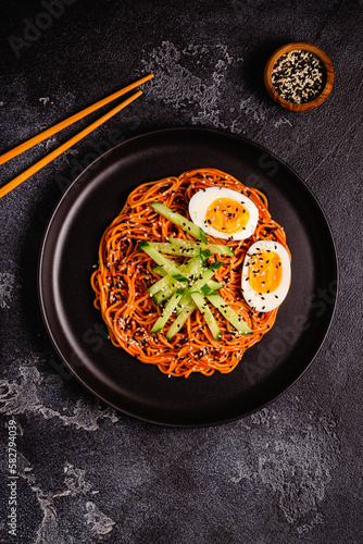 Korean traditional food, cucumber and boiled egg cold spicy noodles.