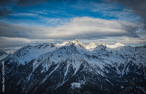 The Dolomites mountains in beautiful winter day. Pinzolo ski resort, Italy. January 2023