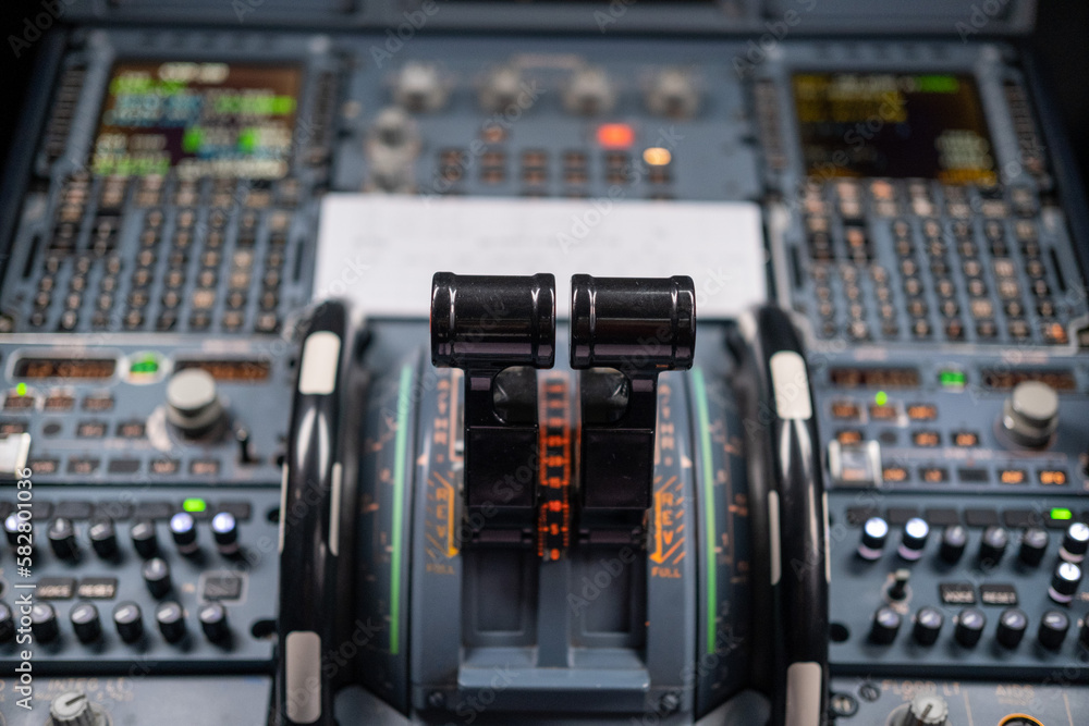 Naklejka premium pilot in command setting control panel in cockpit