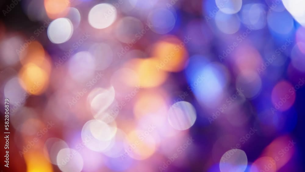 Red, Yellow, and Blue Bokeh Glow on a Dark Background Red, Yellow, and Blue Bokeh Glow on a Dark Background