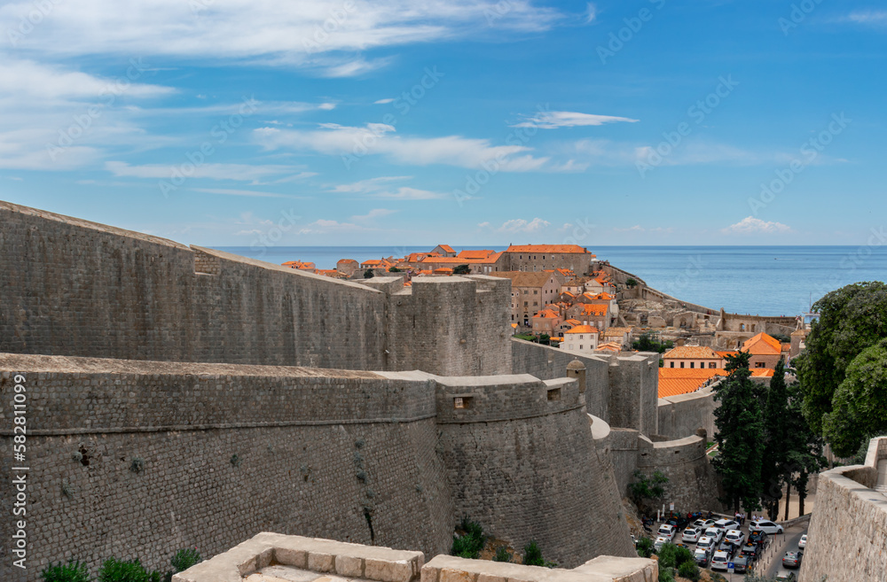 View of red roofs and fortress wall in downtown Dubrovnik, Croatia, city on the Adriatic Sea
