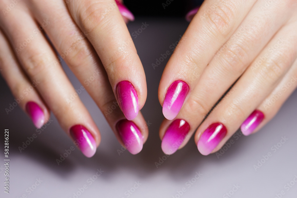 Nail design, manicure with gel polish. Women's hands with a gradient pink manicure. Nail design, manicure with gel polish. Women's hands with a gradient pink manicure.