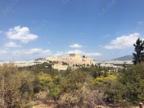 The Acropolis of Athens, Greece, with the Parthenon Temple on top of the hill during a summer sunset