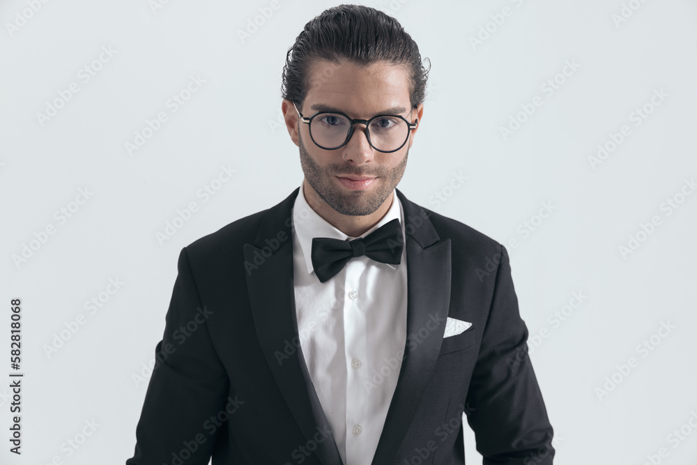 portrait of happy young businessman in black tuxedo smiling portrait of happy young businessman in black tuxedo smiling