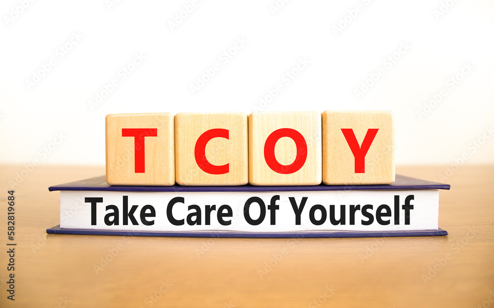 TCOY take care of yourself symbol. Concept words TCOY take care of yourself on wooden block on beautiful white background. Business TCOY take care of yourself concept. Copy space.