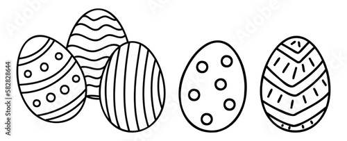 A set of stylized Easter eggs hand-drawn in the doodle style. Linear decor for the spring holiday. Isolated black and white vector illustration.