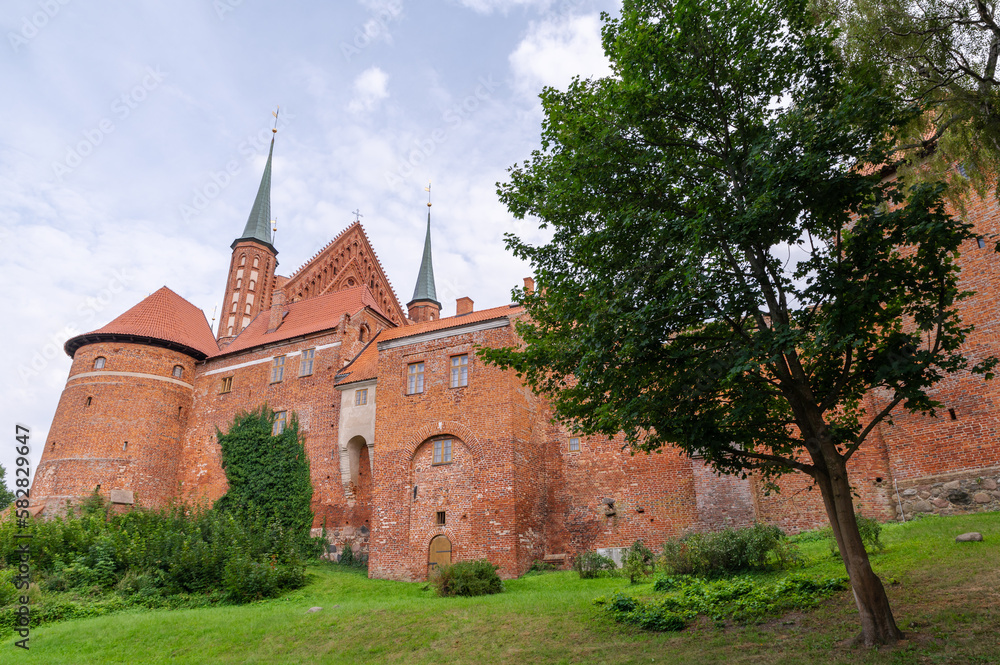 Castle and Cathedral in Frombork, Poland. Frombork is famous the person of astronomer Nicolaus Copernicus where he lived and worked. Castle and Cathedral in Frombork, Poland. Frombork is famous the person of astronomer Nicolaus Copernicus where he lived and worked.