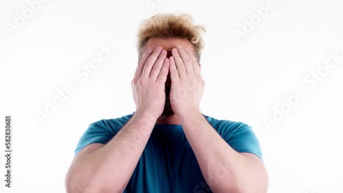 Man opening and covering face with hands, playing hide changing facial expressions. Guy showing various grimaces, happiness sadness amazement, peekaboo gesture isolated on white. photo