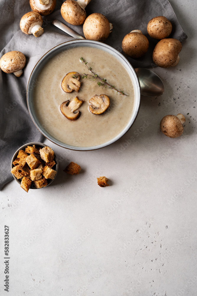 Fototapeta premium Mushroom soup close up with ingredient on white table