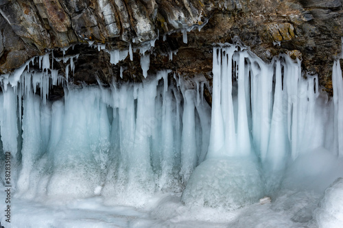 Ice cave on a frozen lake