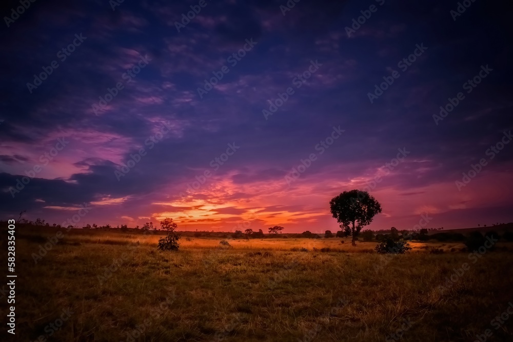 Evening colorful cloudy sky after the sunset with beautiful landscape.