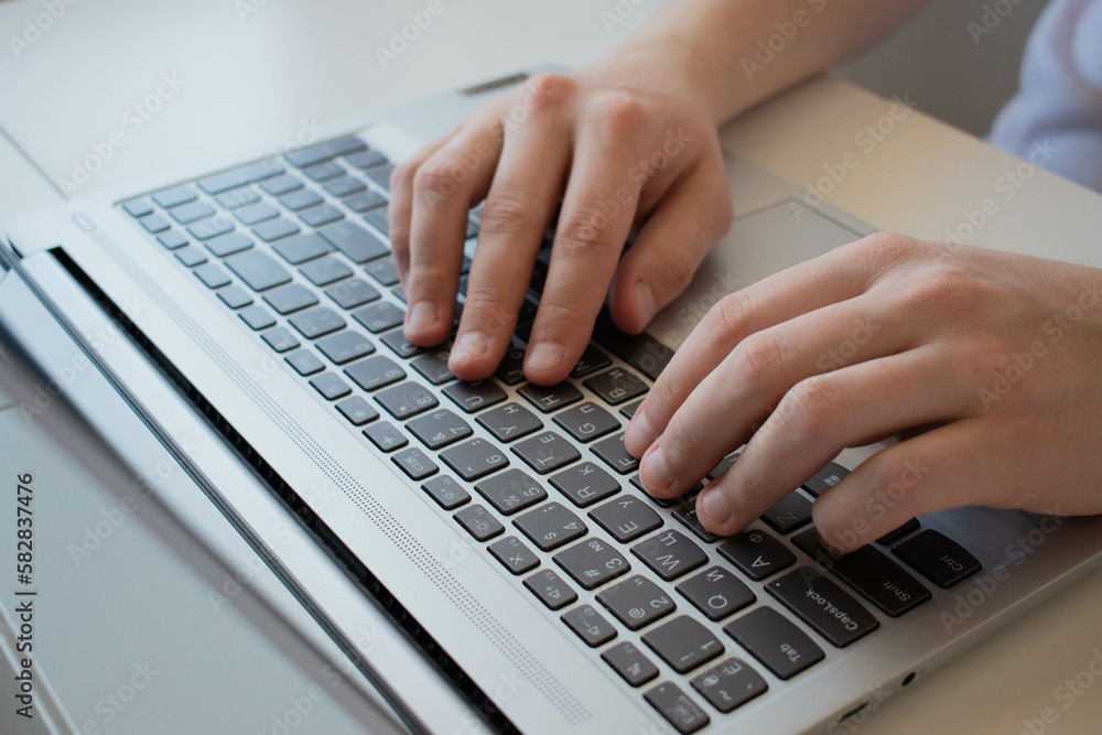 A man's hand uses a trackpad, Using a touchpad on a laptop, A business man works by typing on a laptop. A man's hand uses a trackpad, Using a touchpad on a laptop, A business man works by typing on a laptop.