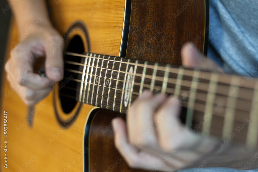 Close up of guitarist playing a acoustic guitar Close up of guitarist playing a acoustic guitar