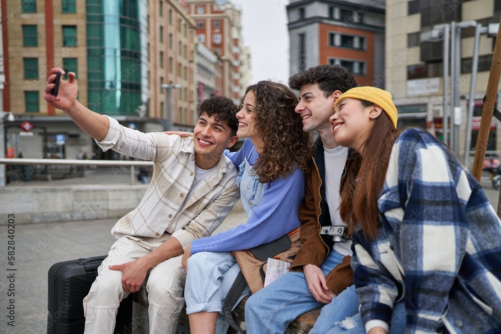 Fototapeta premium Friends taking selfie on a bench in Spain.