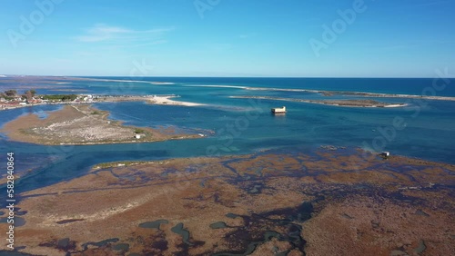 Aerial view. Drone flight over the natural Portuguese park Ria formosa over the village of Fuseta.