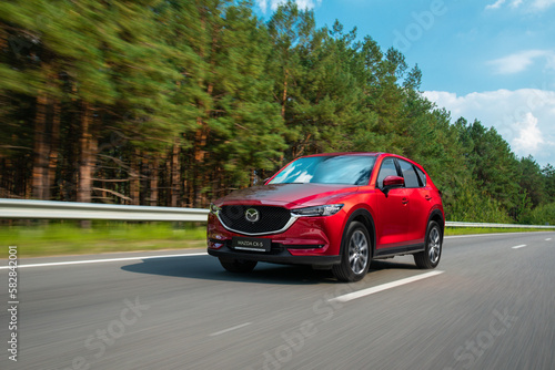 Φωτογραφία Kyiv, Ukraine -September 1, 2021: Car on the road, red Mazda CX-5 in motion on h